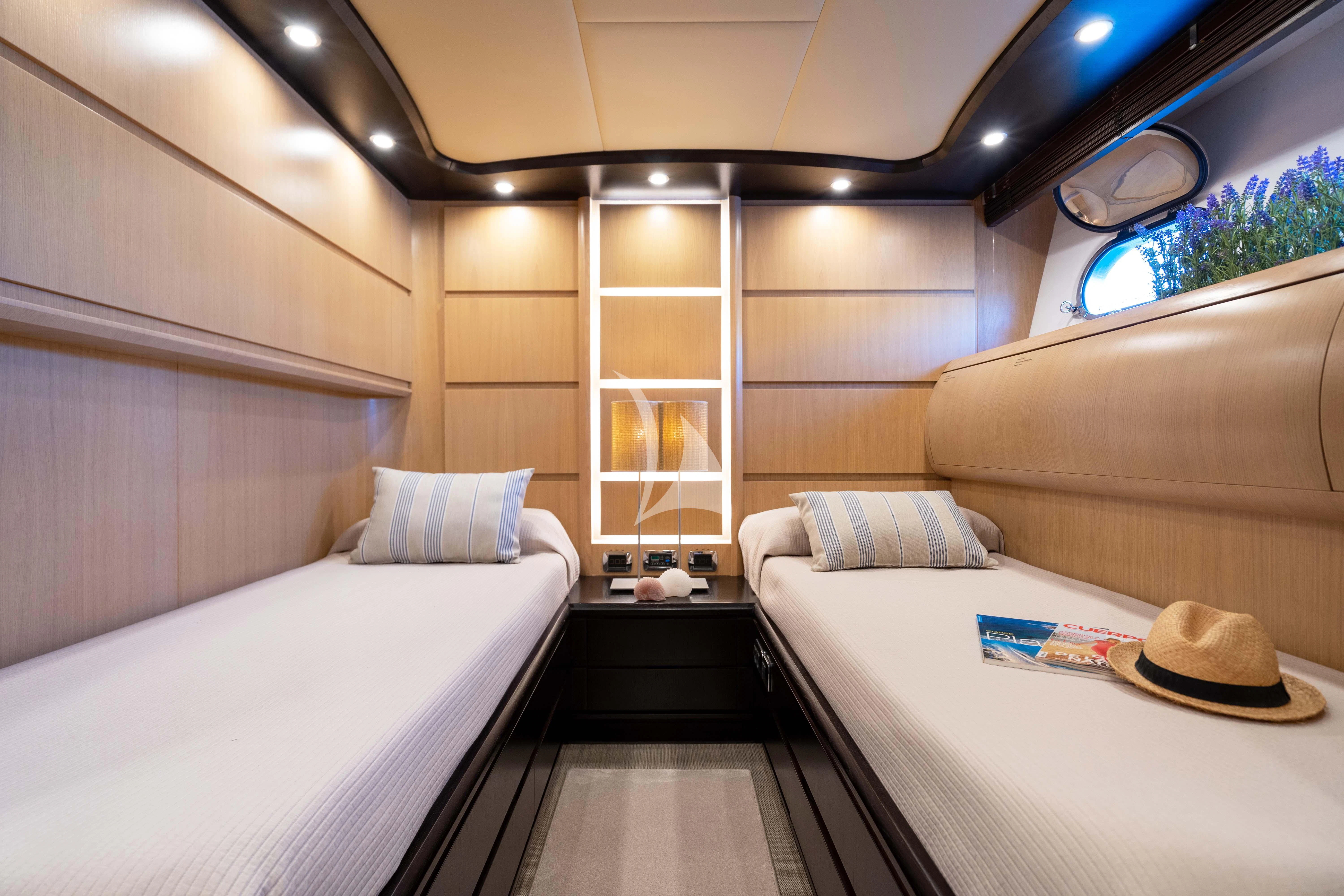 a room with a bed and a hat aboard DOLCE VITA IV Yacht for Sale