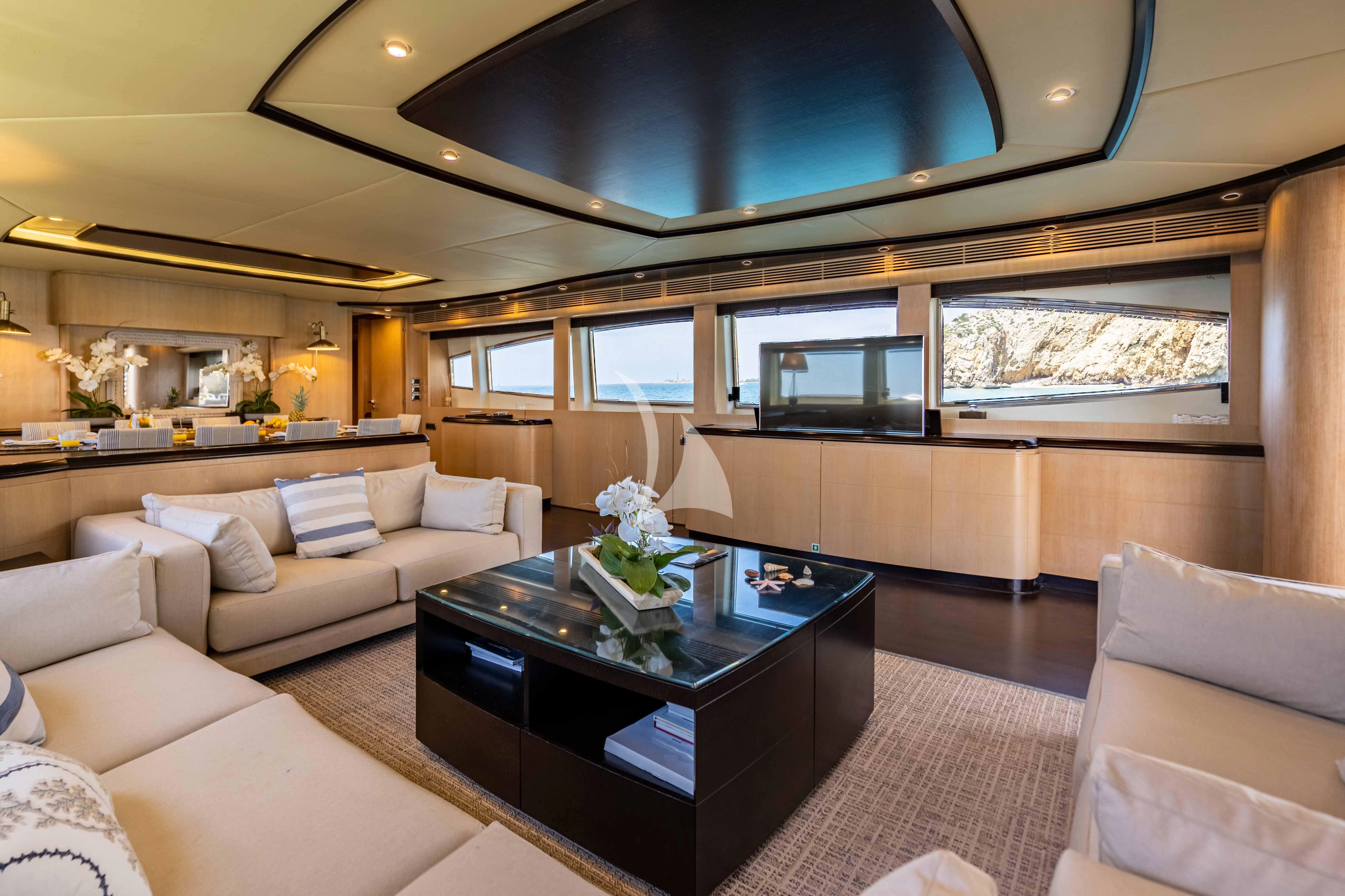 a living room with a large mirror aboard DOLCE VITA IV Yacht for Sale