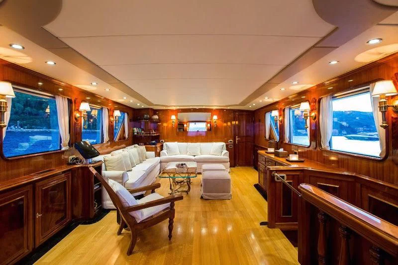 a living room with a wood floor aboard LIBERTUS Yacht for Sale