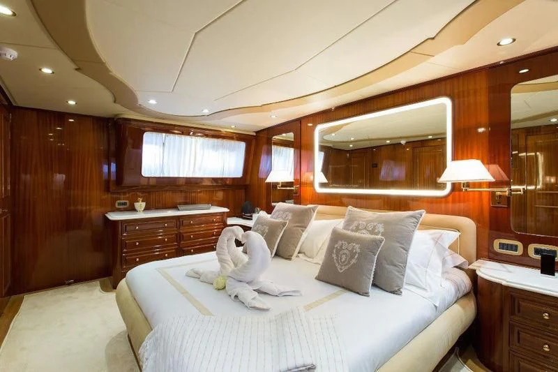 a bed in a cabin aboard LIBERTUS Yacht for Sale