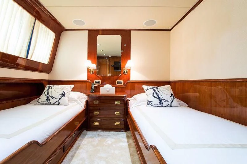 a couple of beds in a hotel room aboard LIBERTUS Yacht for Sale