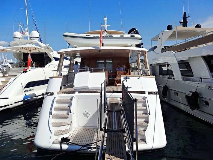a group of boats are parked in a harbor aboard LIBERTUS Yacht for Sale