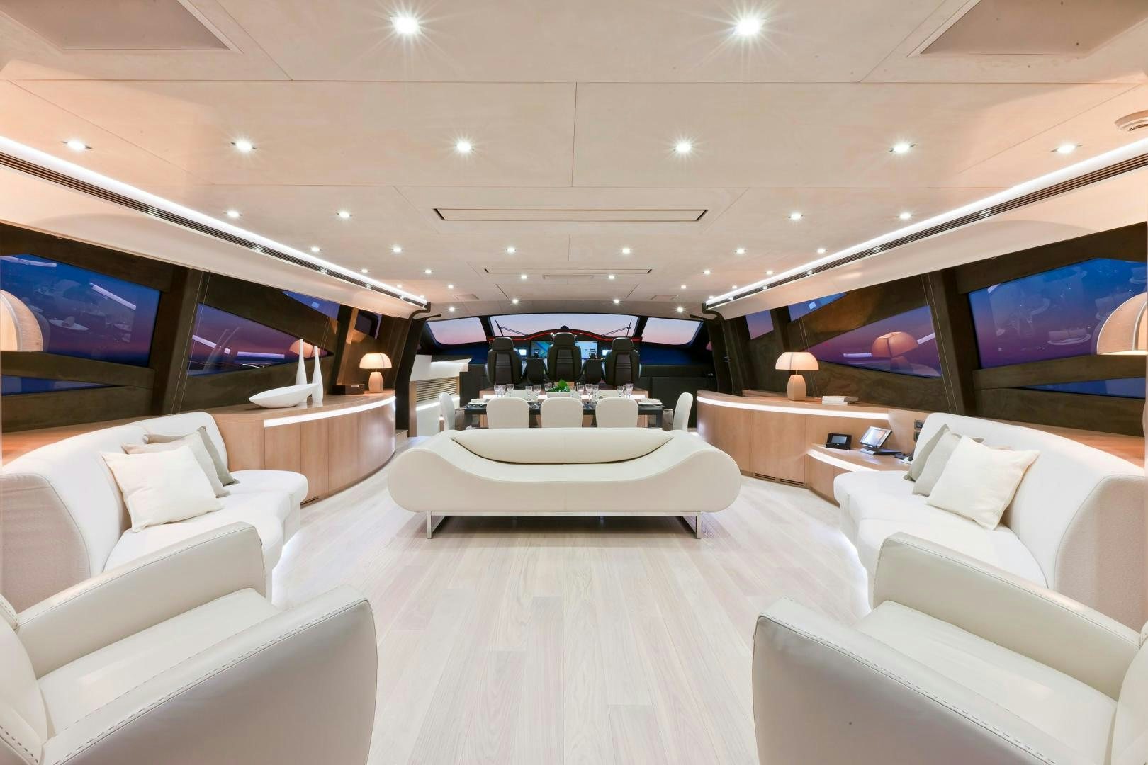 a room with a large white table and chairs aboard KUIKILA Yacht for Sale