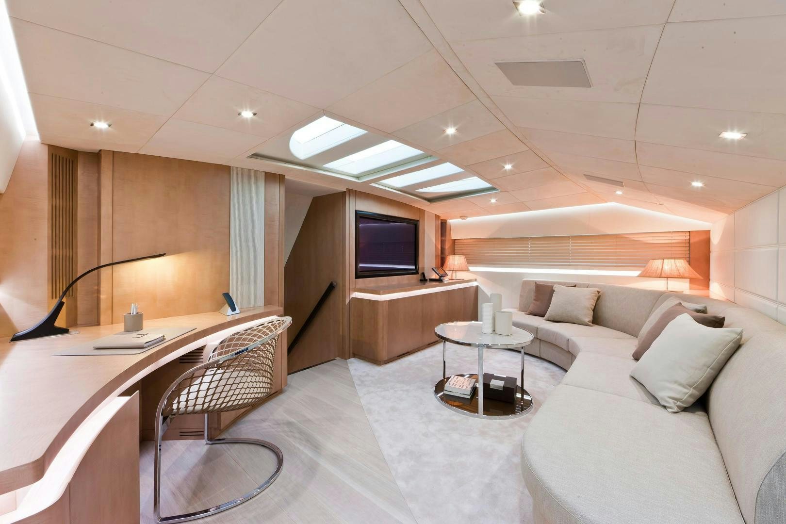 a room with a couch and a television aboard KUIKILA Yacht for Sale