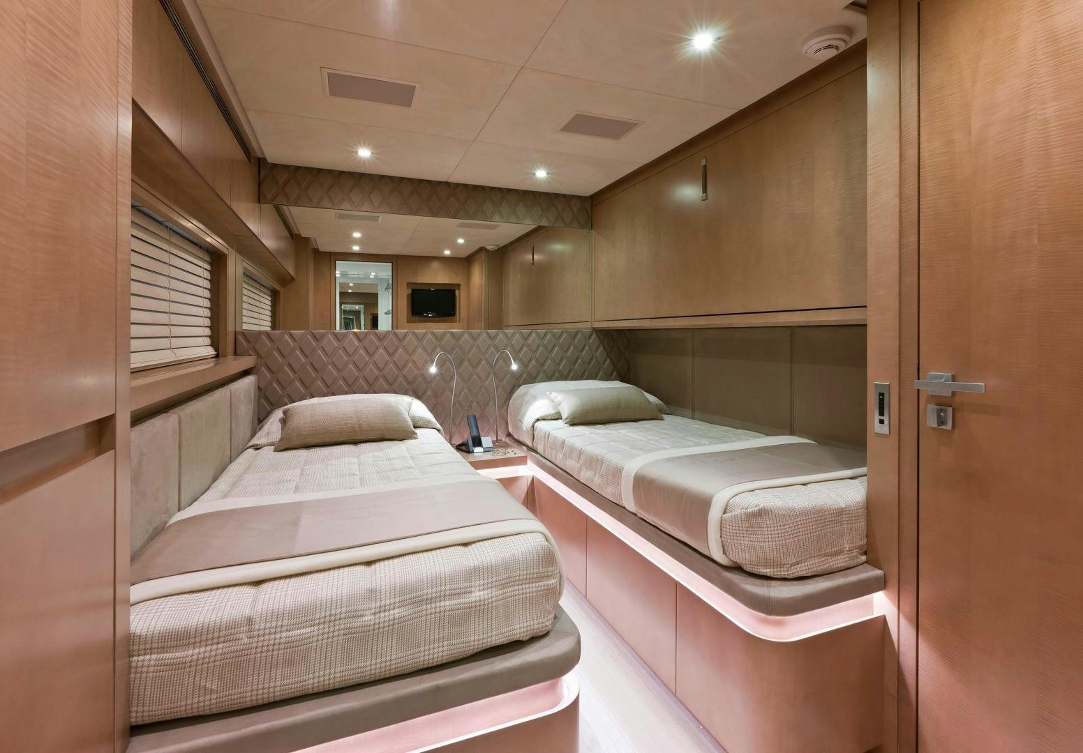 a room with two beds aboard KUIKILA Yacht for Sale