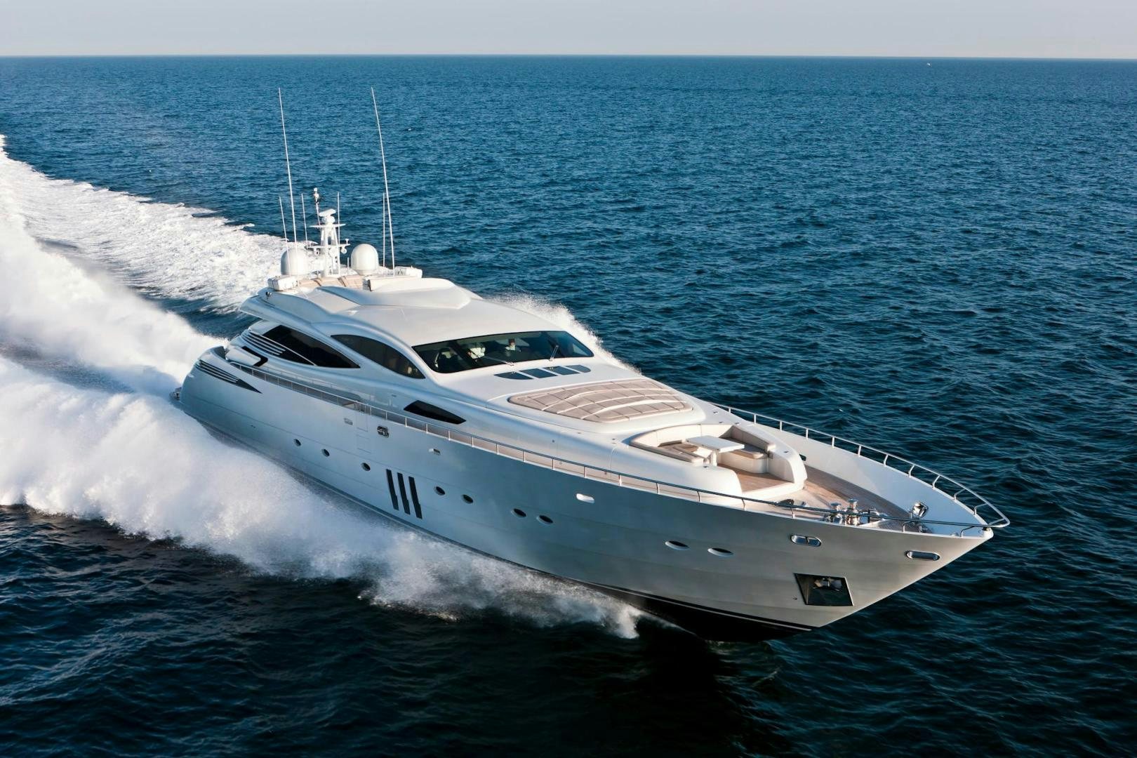 a white yacht on the water aboard KUIKILA Yacht for Sale