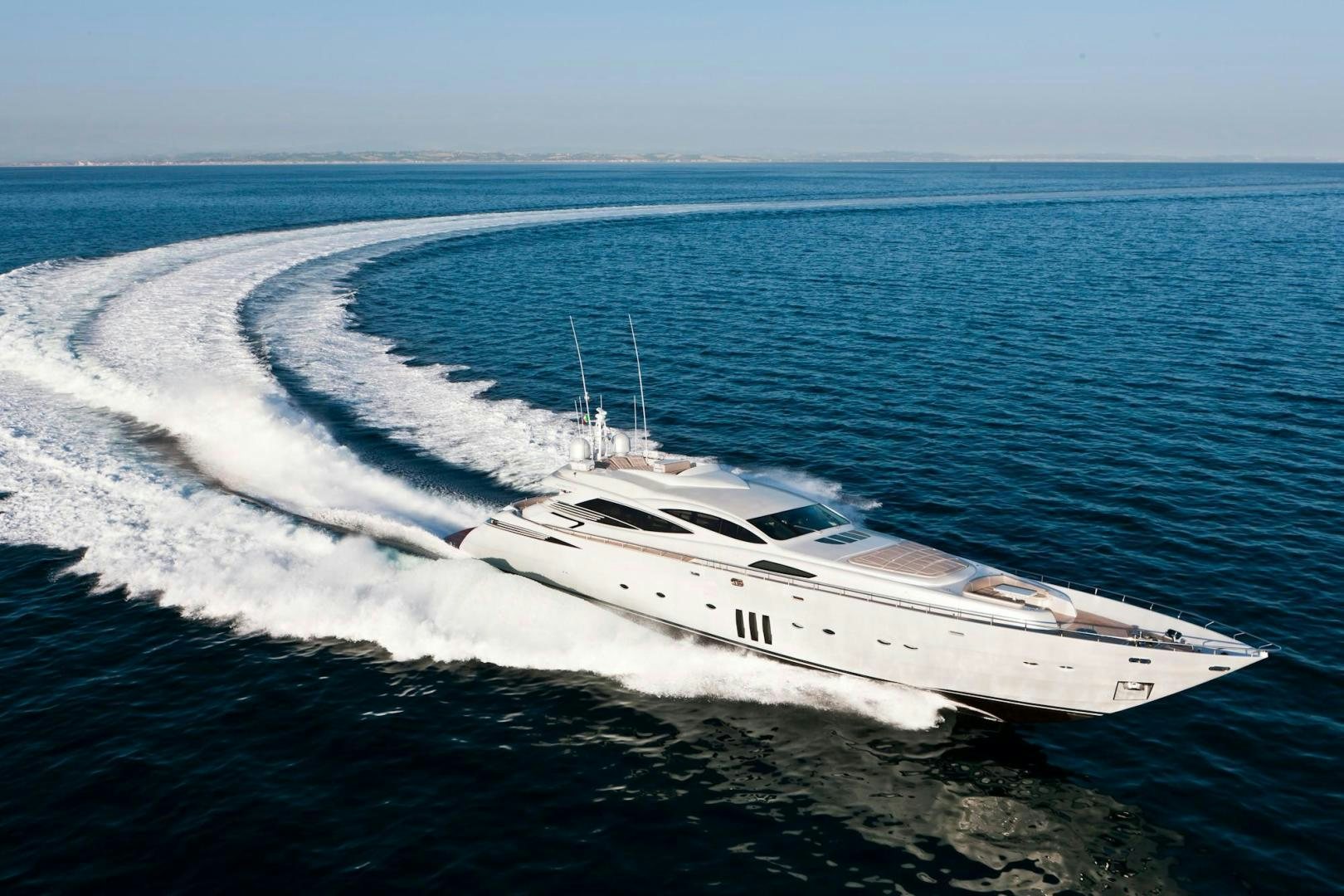 a white yacht on the water aboard KUIKILA Yacht for Sale