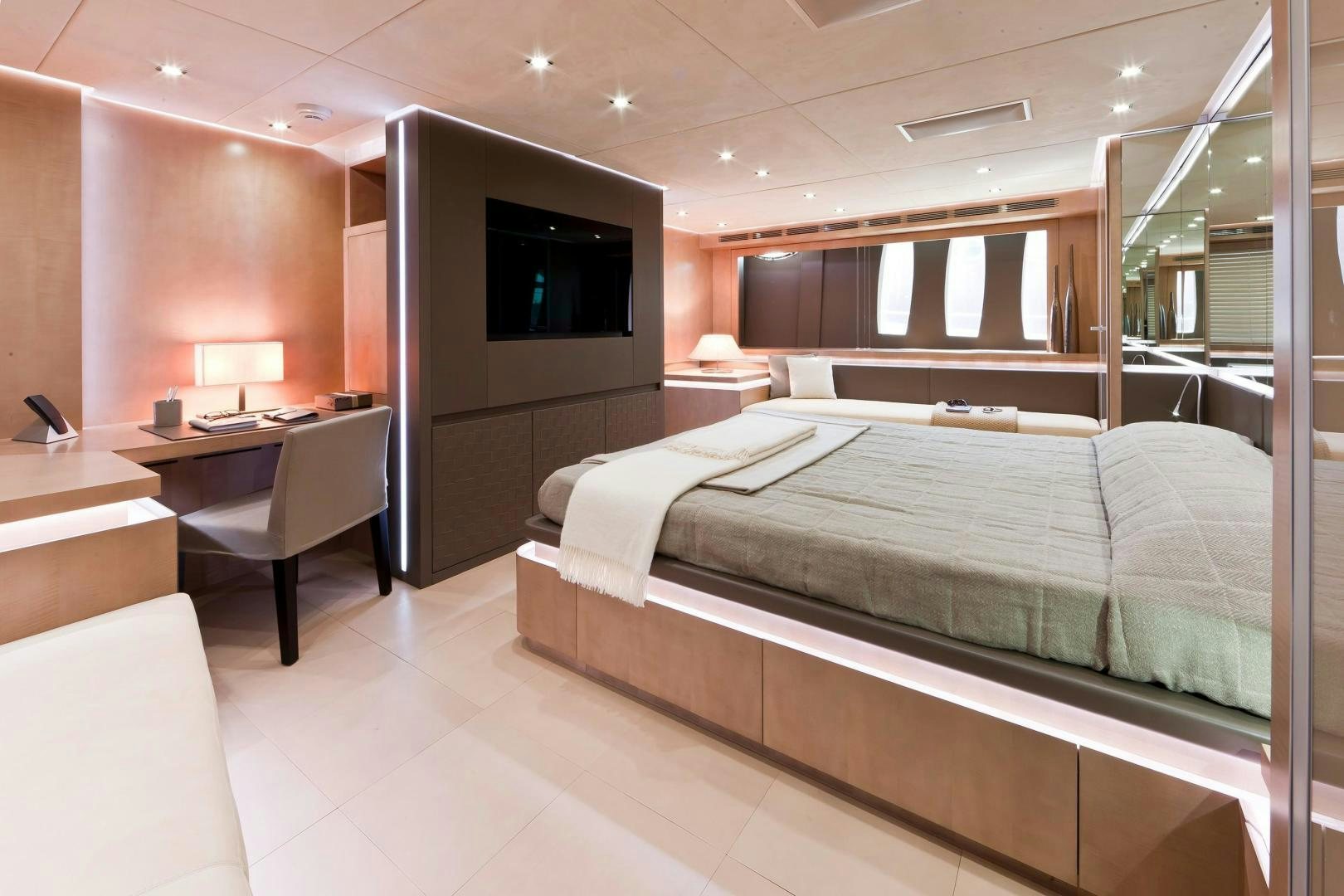 a room with a bed and a desk aboard KUIKILA Yacht for Sale