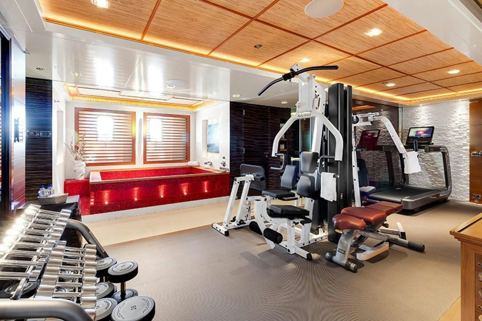 a gym with exercise equipment aboard QUANTUM OF SOLACE Yacht for Sale
