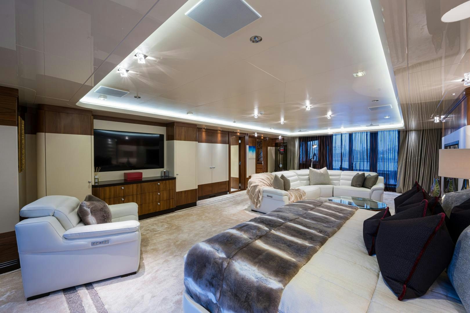 a living room with a couch and a tv aboard QUANTUM OF SOLACE Yacht for Sale