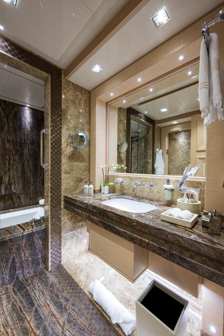 a bathroom with a large mirror aboard QUANTUM OF SOLACE Yacht for Sale