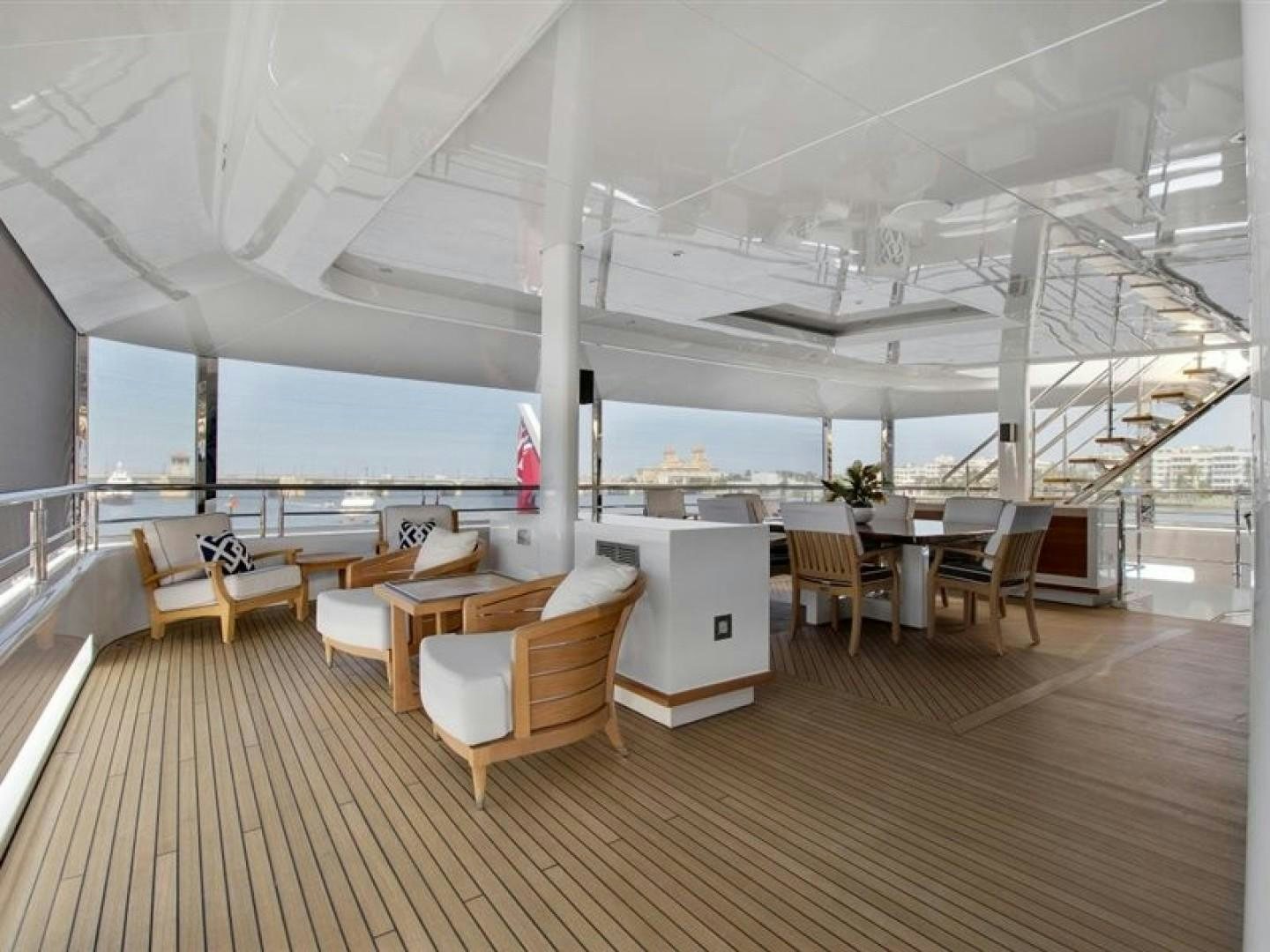 a room with chairs and tables aboard QUANTUM OF SOLACE Yacht for Sale