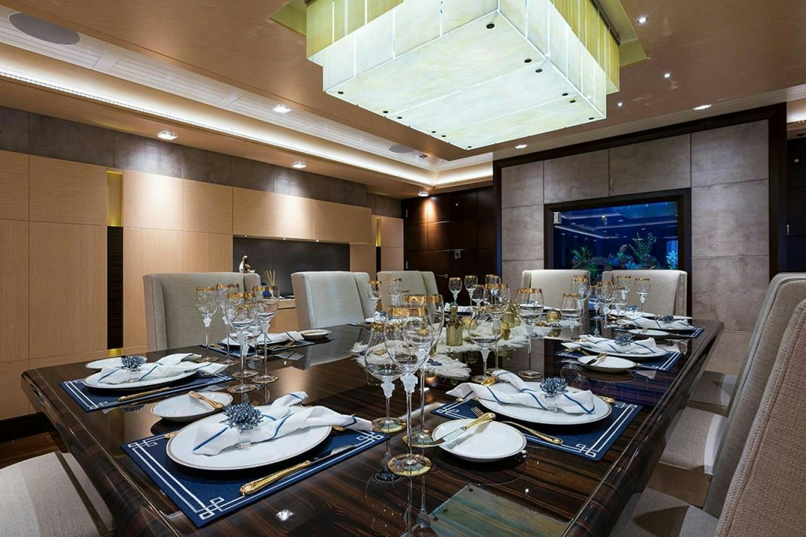 a table set for a dinner aboard QUANTUM OF SOLACE Yacht for Sale