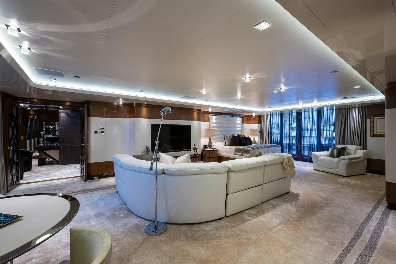 a large living room with a large open floor plan aboard QUANTUM OF SOLACE Yacht for Sale