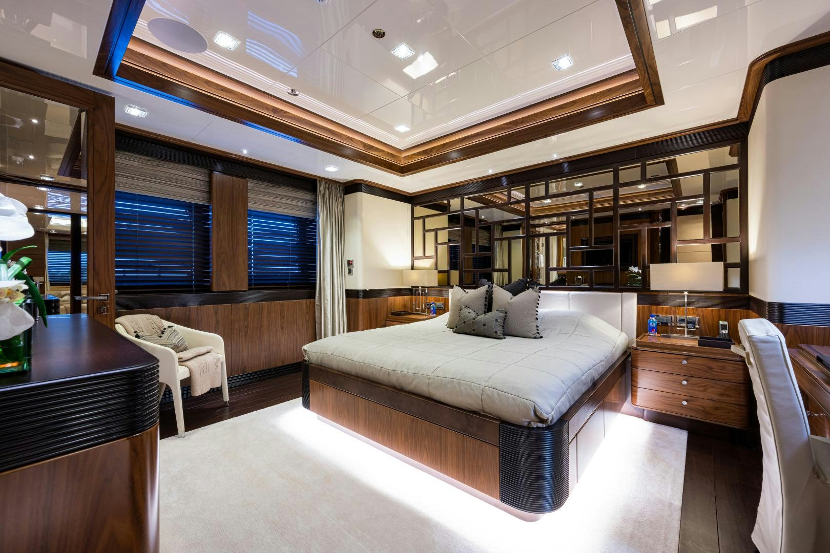 a large room with a bed and a couch aboard QUANTUM OF SOLACE Yacht for Sale