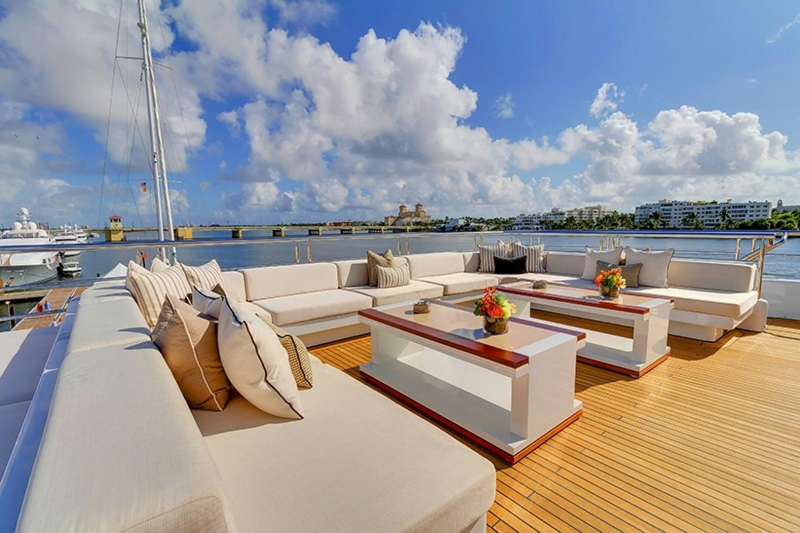 a room with a table and chairs aboard QUANTUM OF SOLACE Yacht for Sale