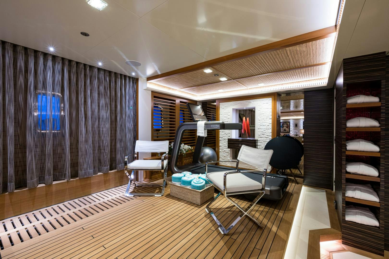 a room with a bed and a desk aboard QUANTUM OF SOLACE Yacht for Sale
