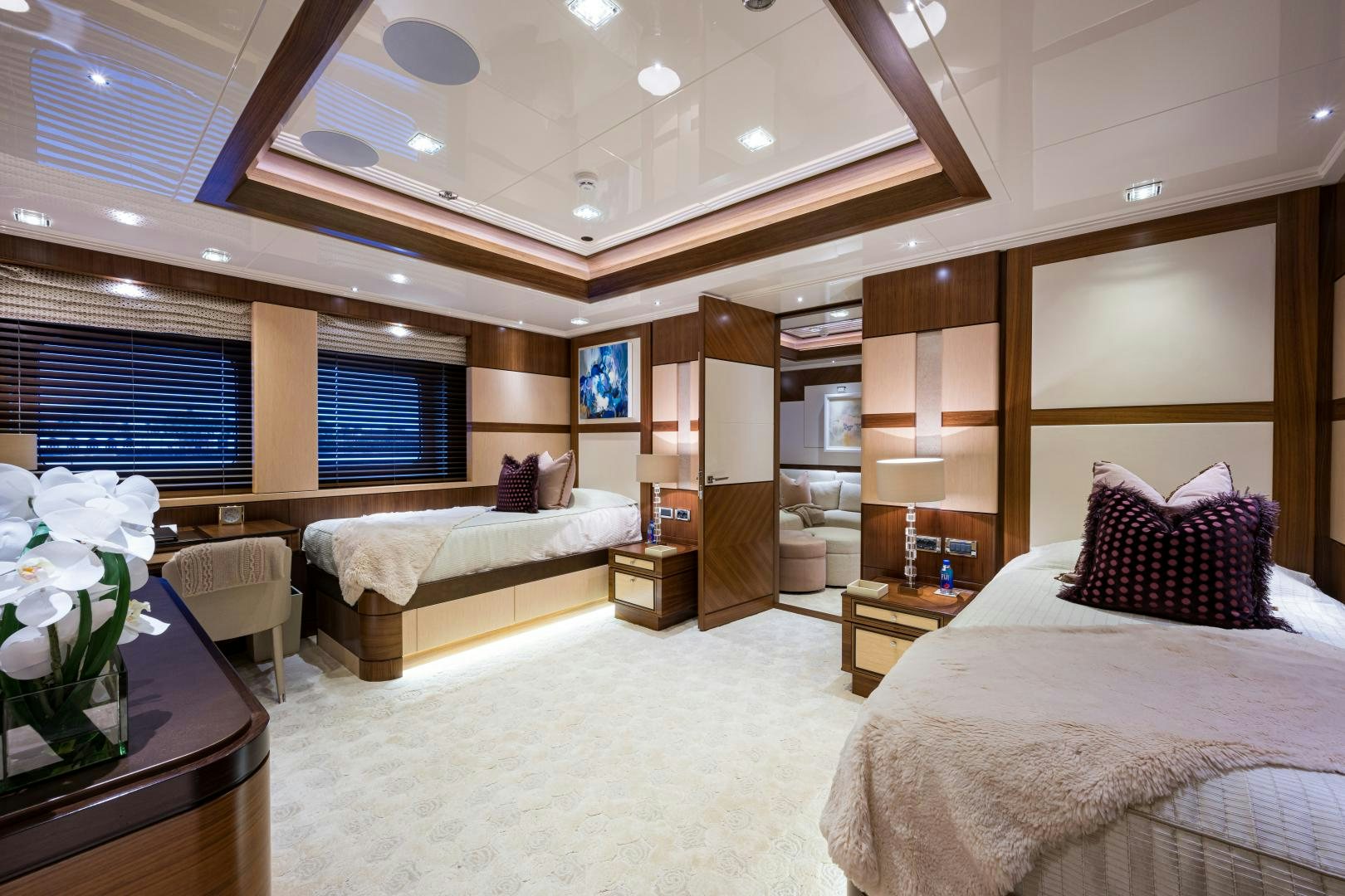 a room with a bed and a desk aboard QUANTUM OF SOLACE Yacht for Sale