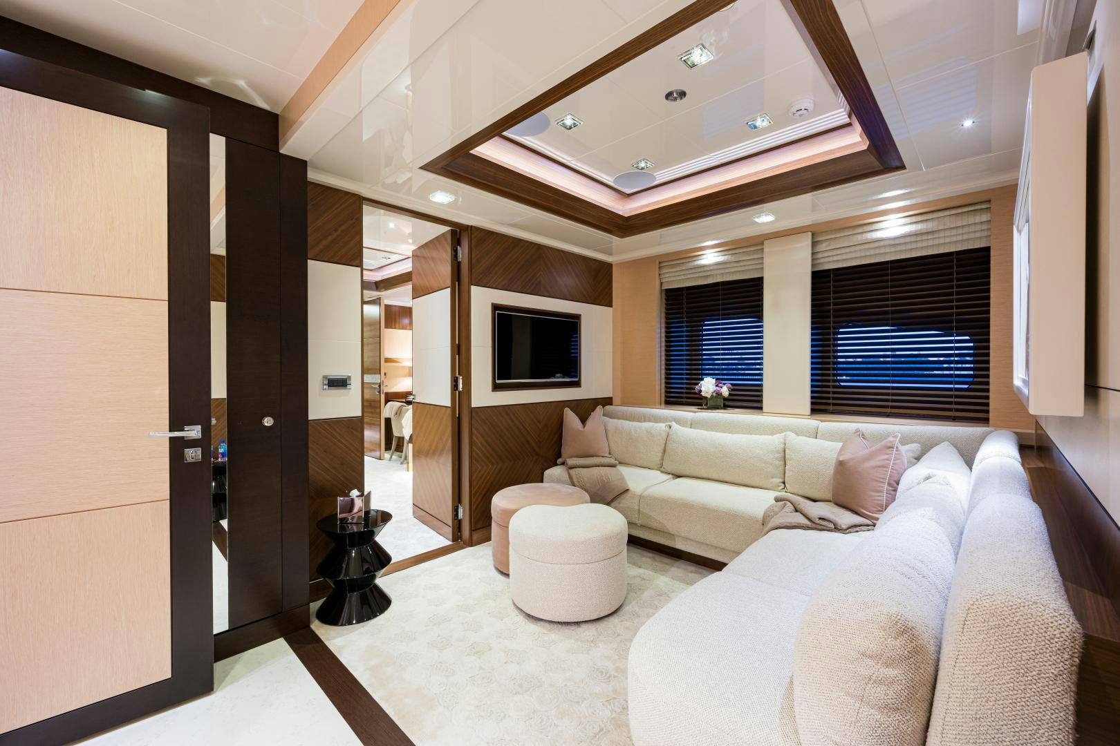 a living room with a couch and a tv aboard QUANTUM OF SOLACE Yacht for Sale