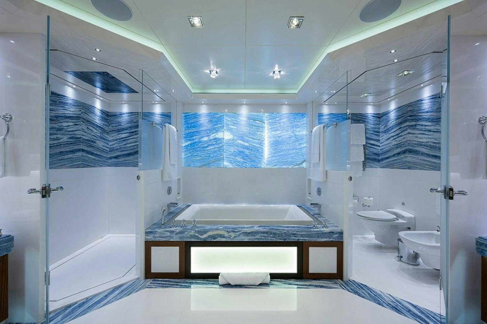 a bathroom with a large tub aboard QUANTUM OF SOLACE Yacht for Sale
