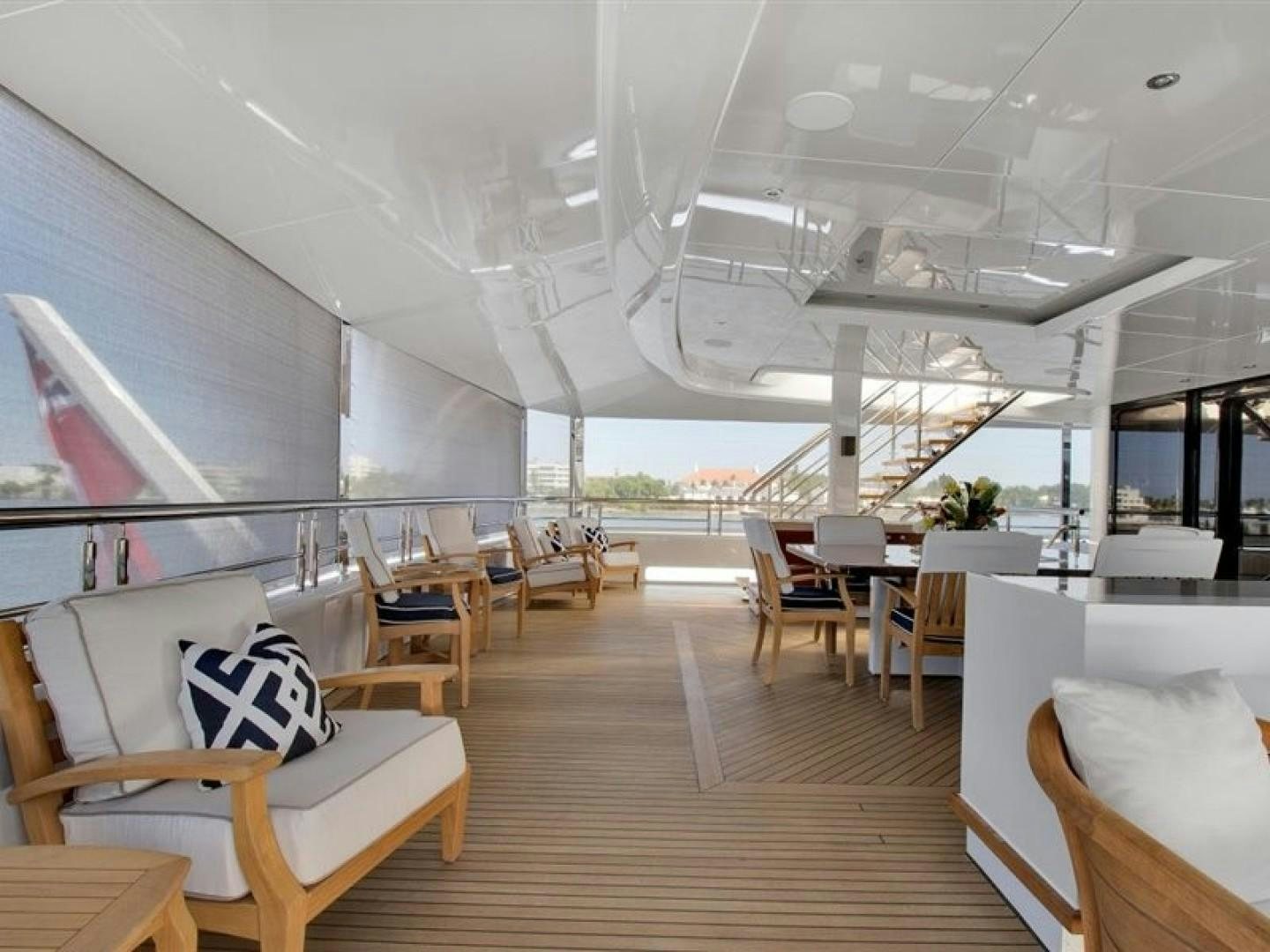 a room with chairs and tables aboard QUANTUM OF SOLACE Yacht for Sale