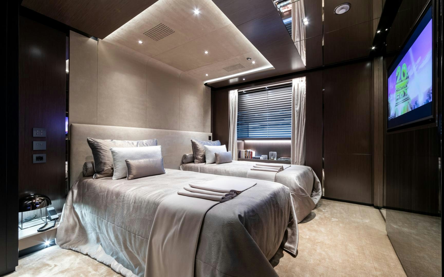 a hotel room with two beds aboard SOLO Yacht for Sale