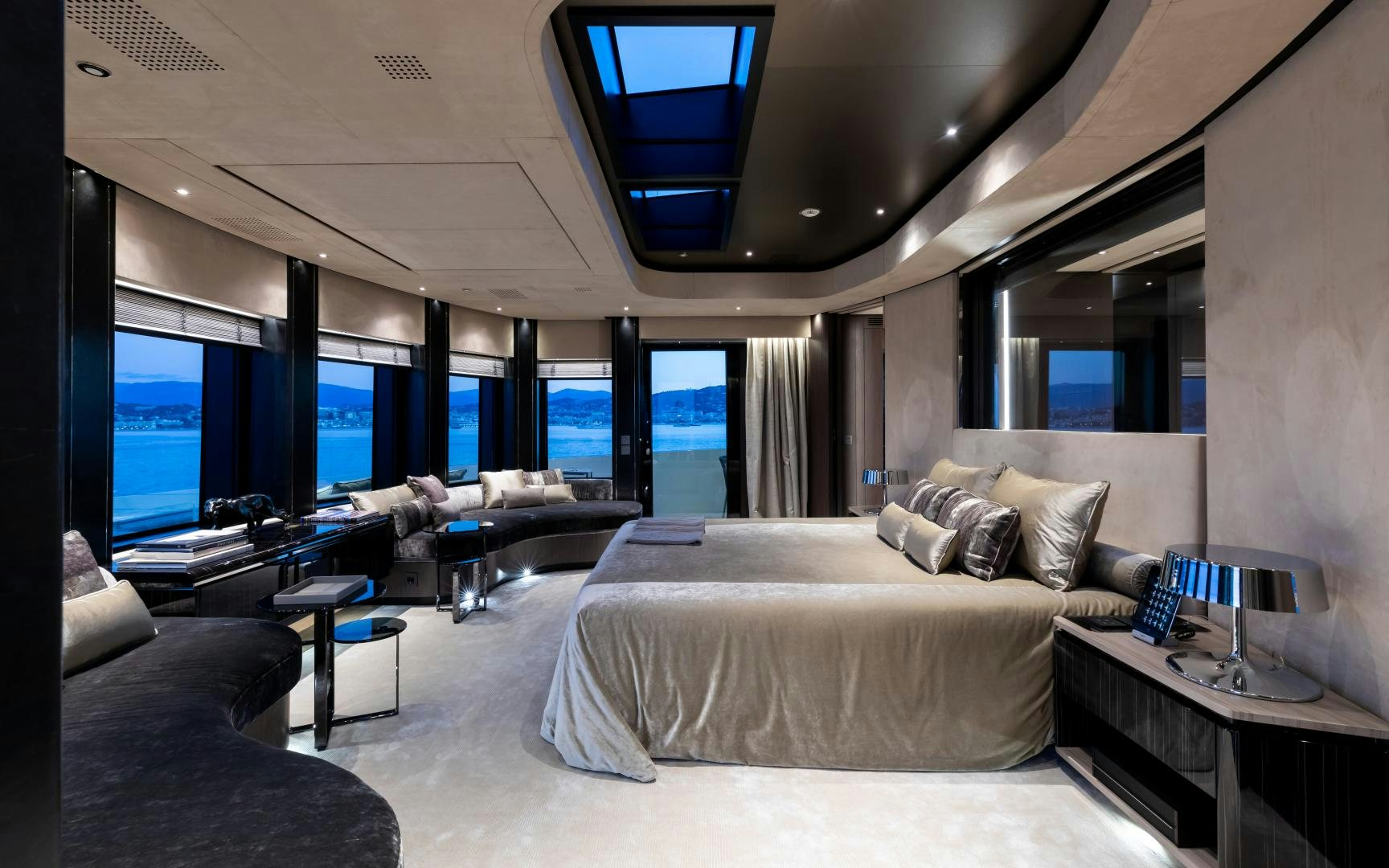 a room with a bed and a large window aboard SOLO Yacht for Sale