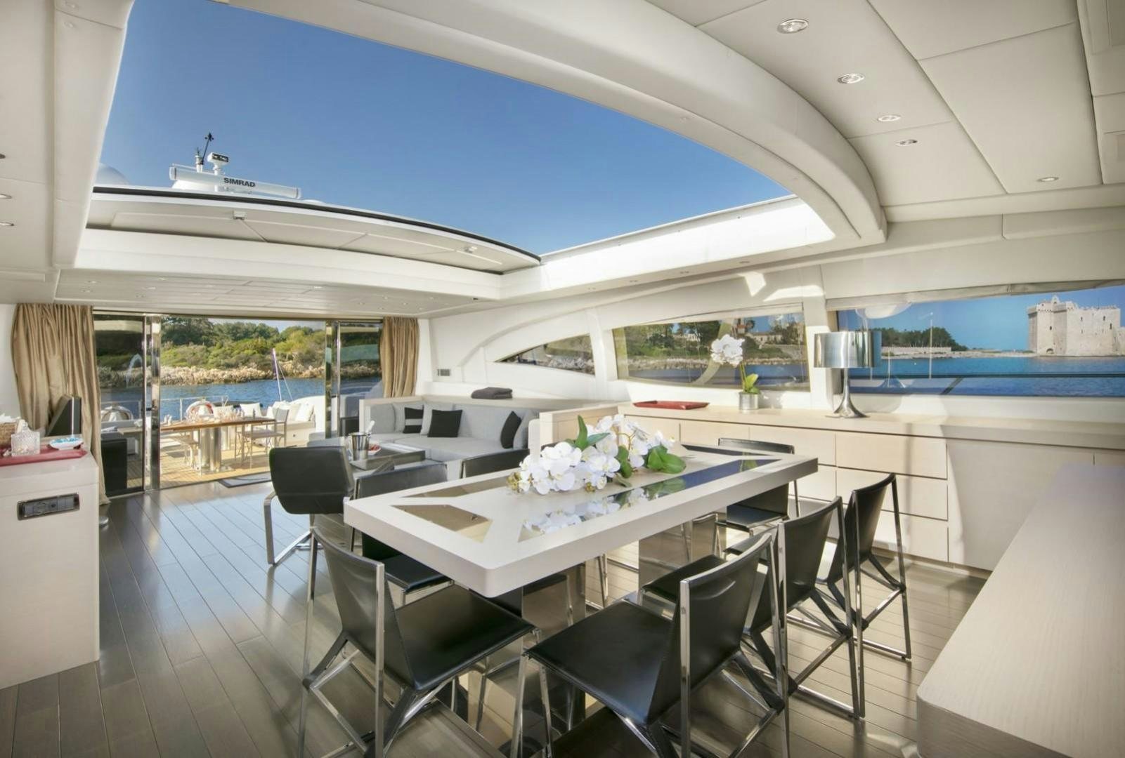 a large room with a table and chairs aboard MOSKING Yacht for Sale