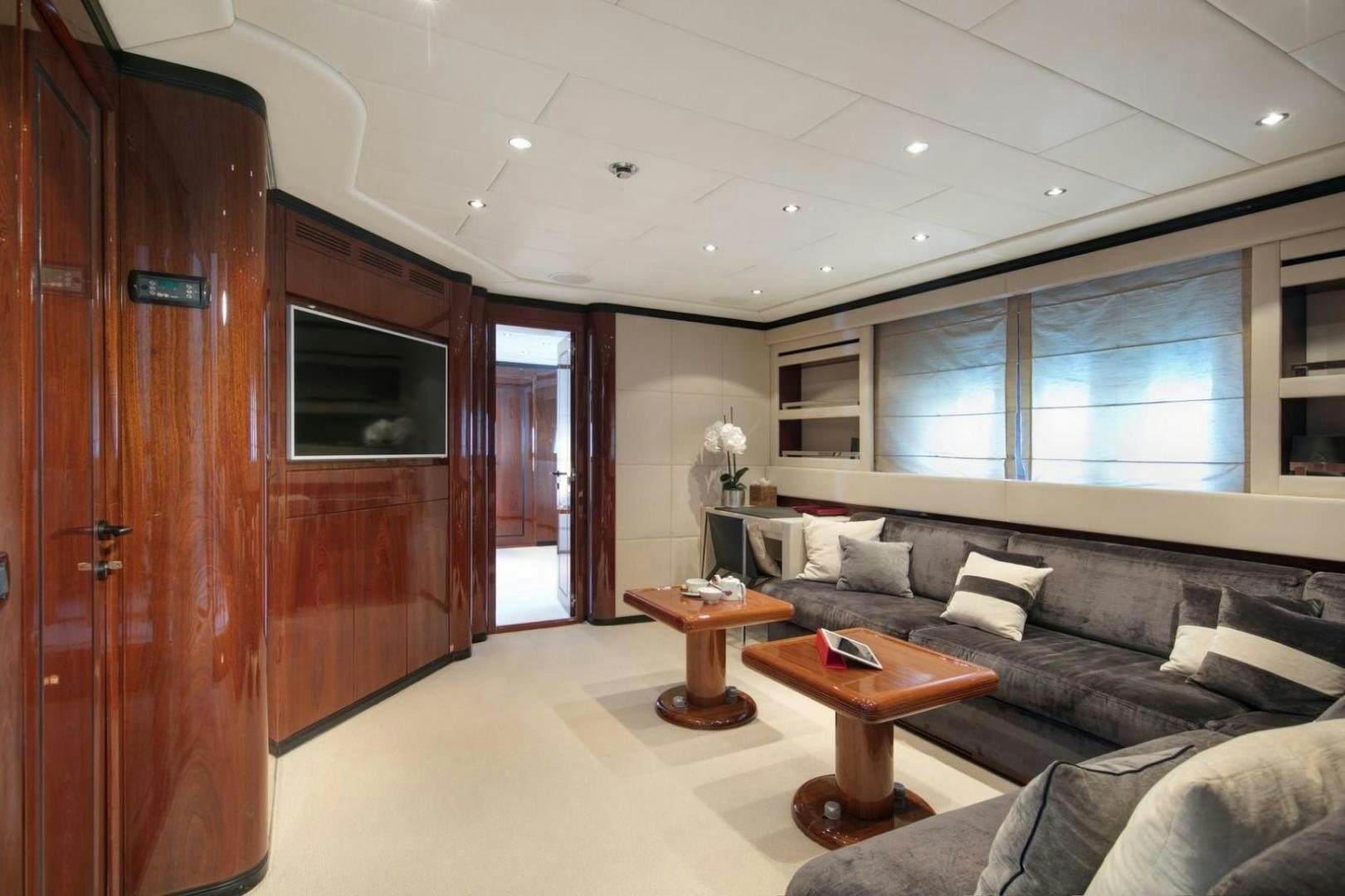 a living room with a couch and a coffee table aboard MOSKING Yacht for Sale