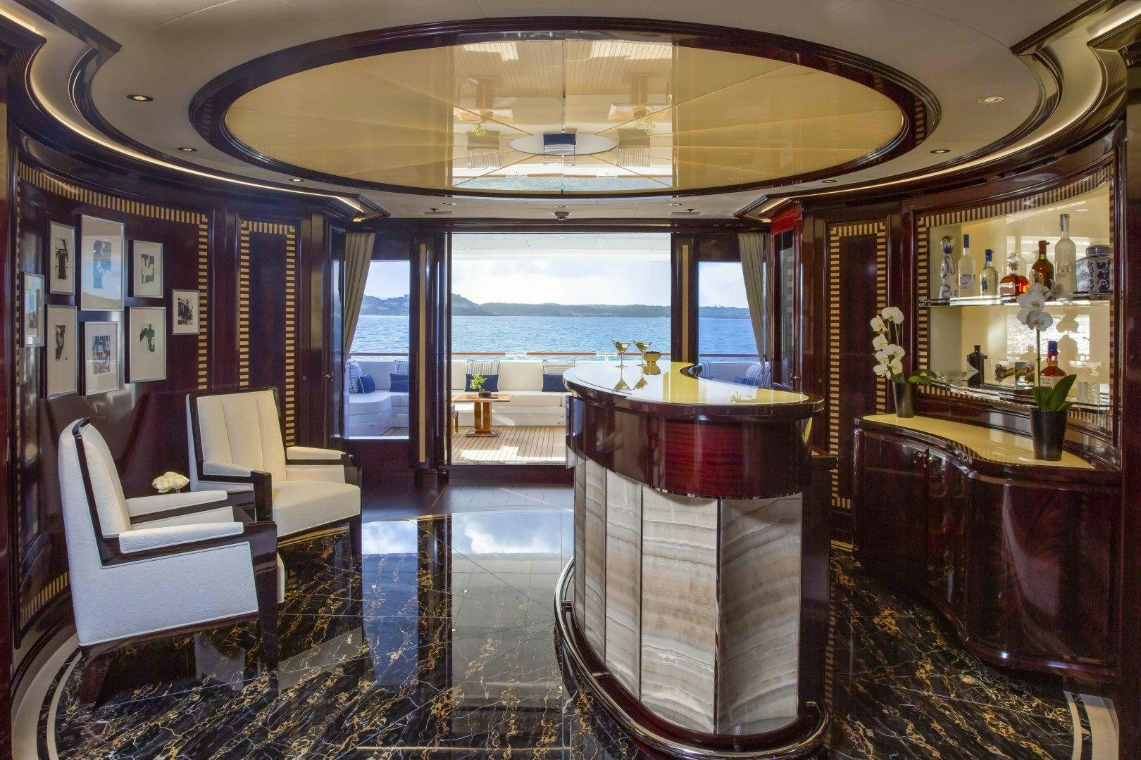 a room with a table chairs and a window aboard ROCK.IT Yacht for Charter