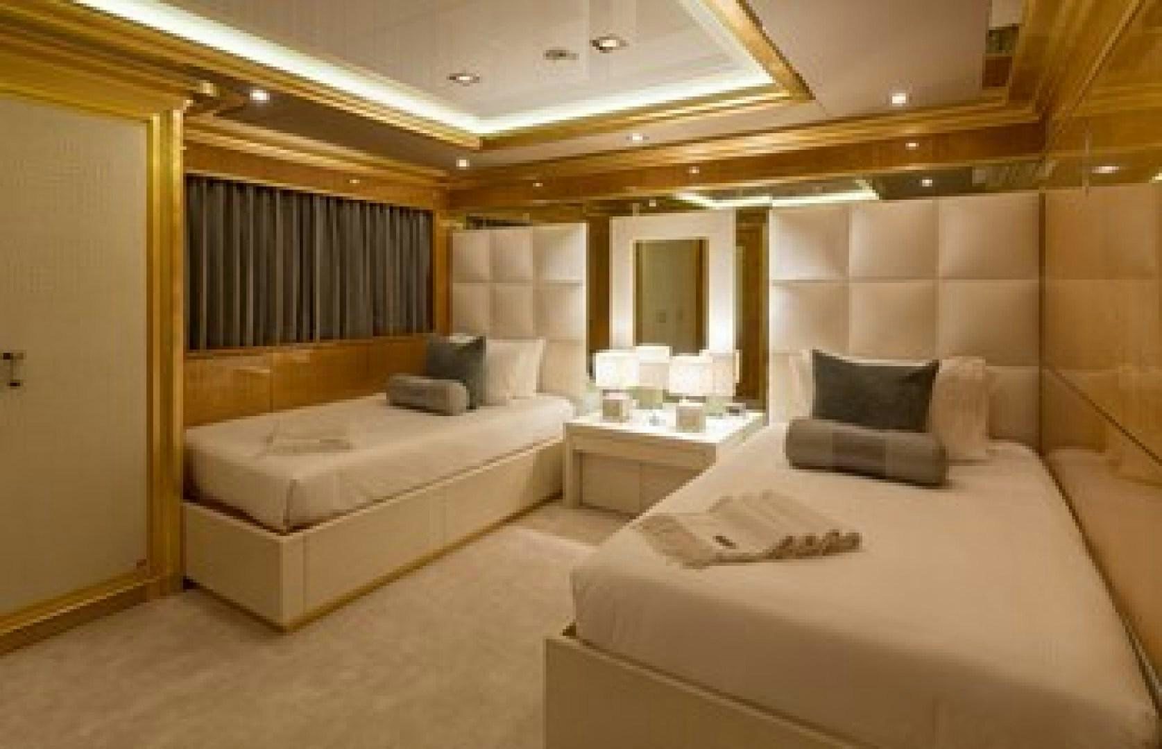 a room with two beds aboard ANDIAMO Yacht for Sale