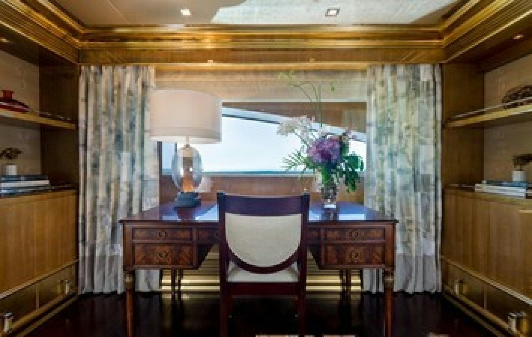 a room with a table and chairs aboard ANDIAMO Yacht for Sale