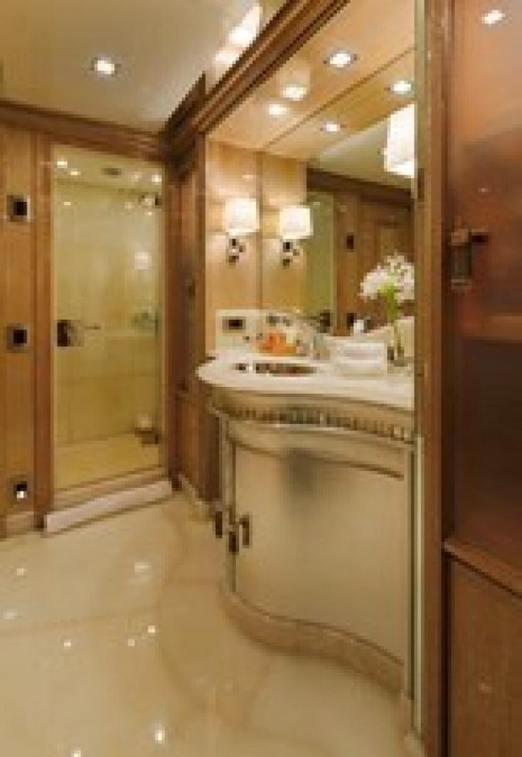 a bathroom with a large mirror aboard ANDIAMO Yacht for Sale