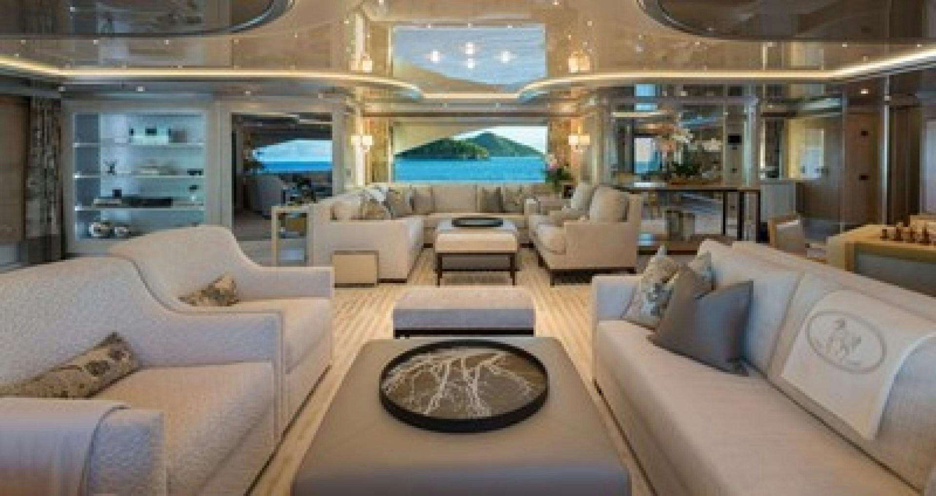 a large living room with a large swimming pool aboard ANDIAMO Yacht for Sale