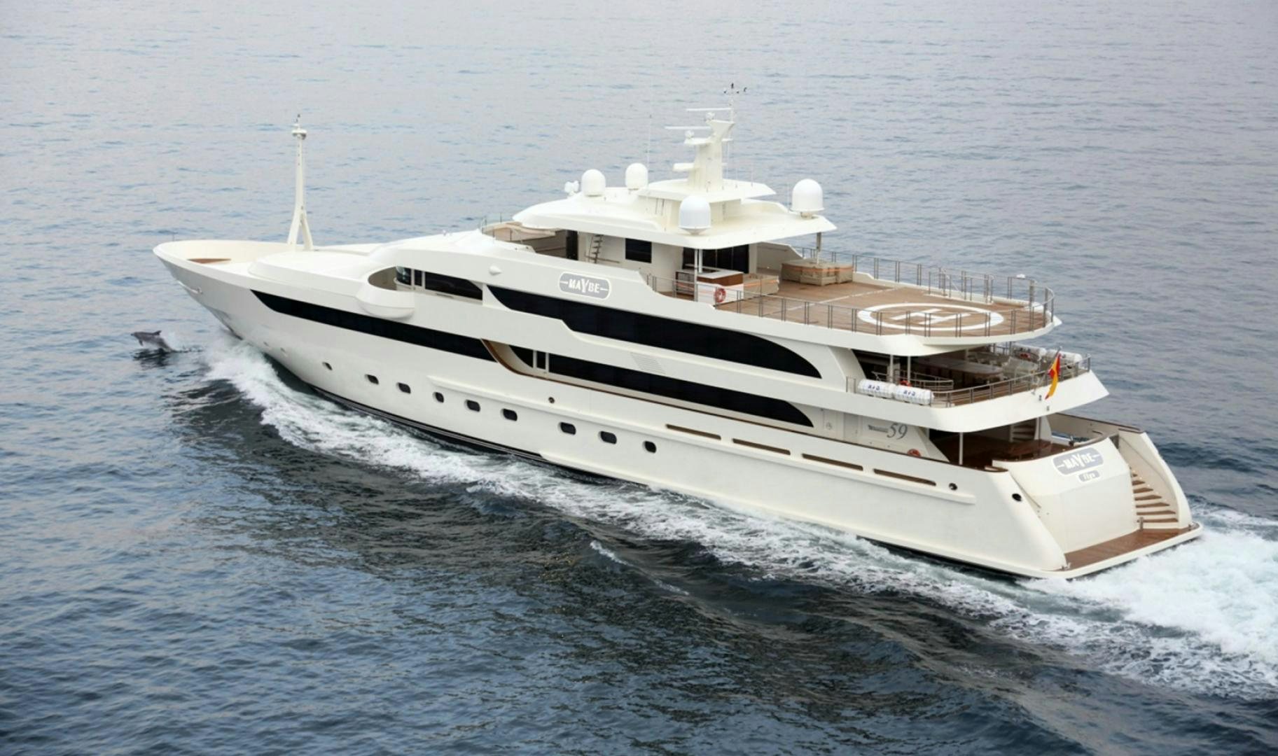 a white yacht on the water aboard MAYBE Yacht for Sale