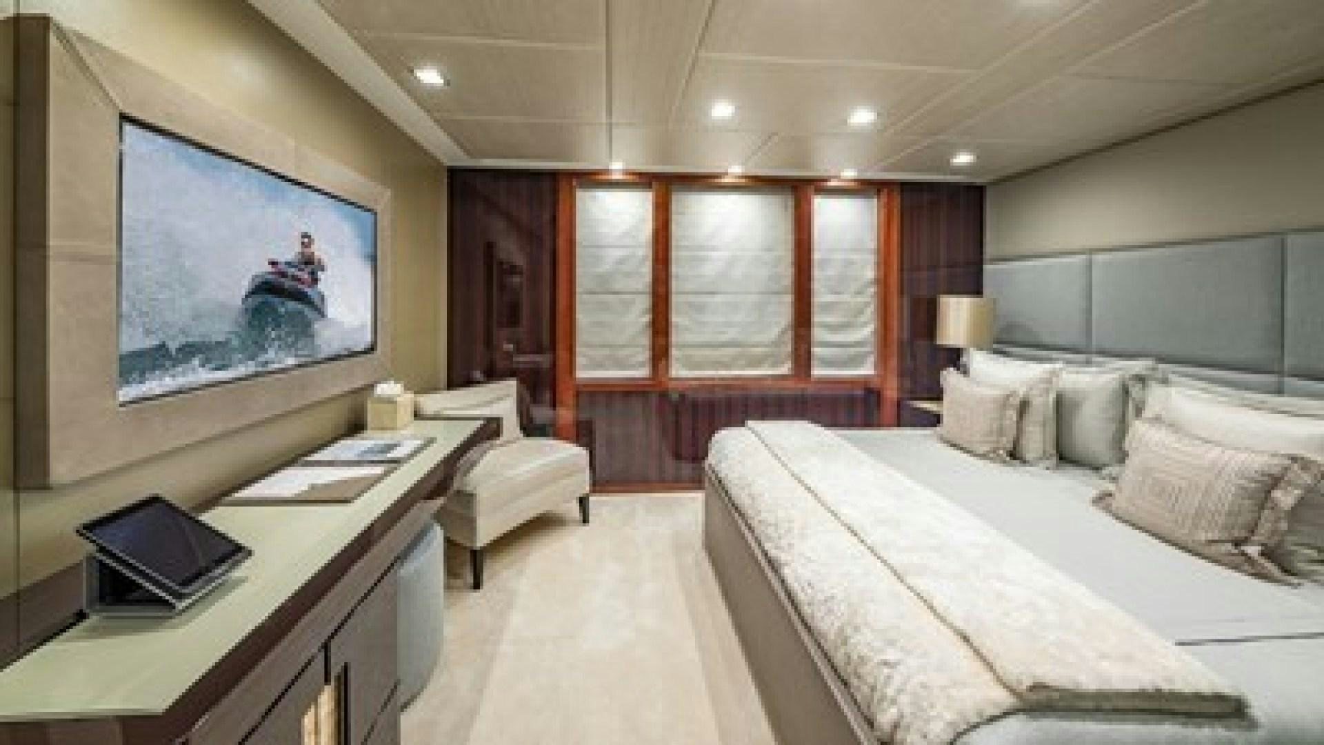 a room with a bed and a desk aboard HOLDIN' MY OWN Yacht for Sale