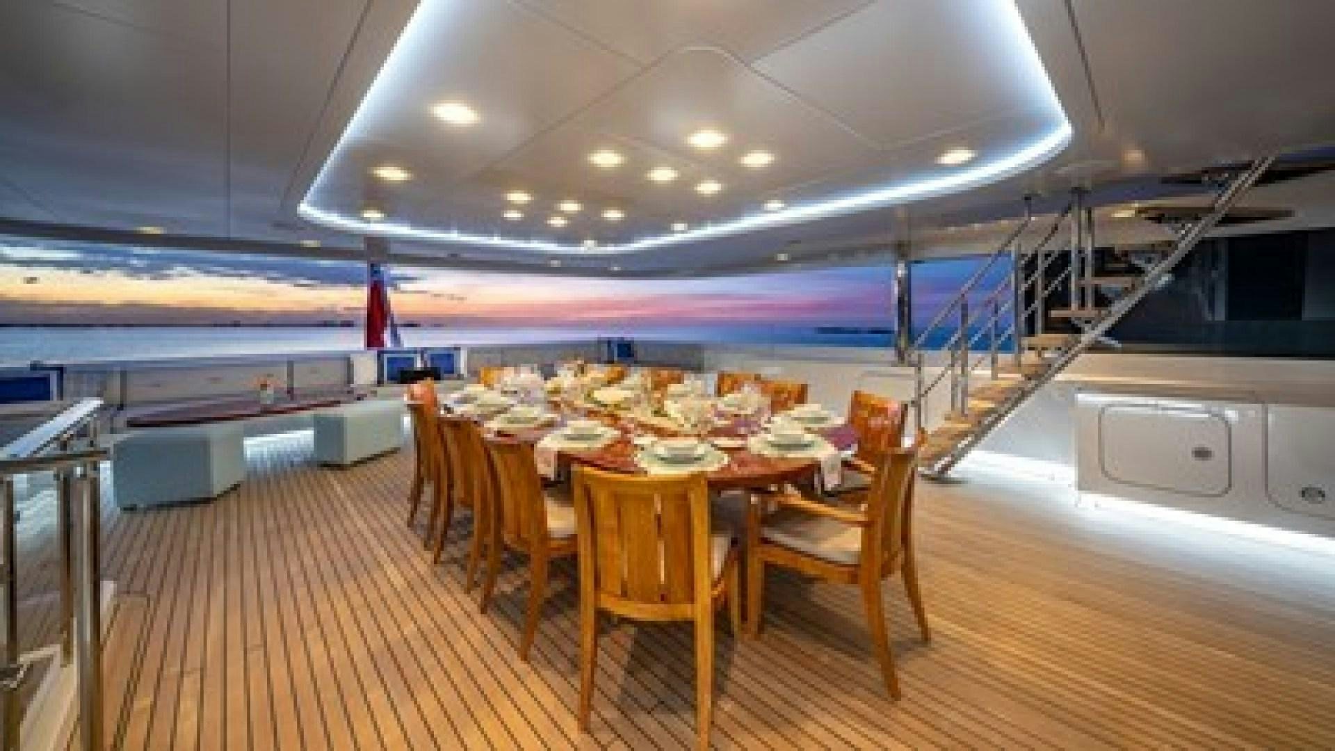 a large kitchen with a table and chairs aboard HOLDIN' MY OWN Yacht for Sale