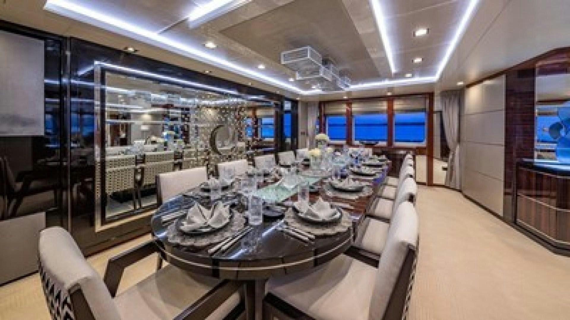 a large room with tables and chairs aboard HOLDIN' MY OWN Yacht for Sale