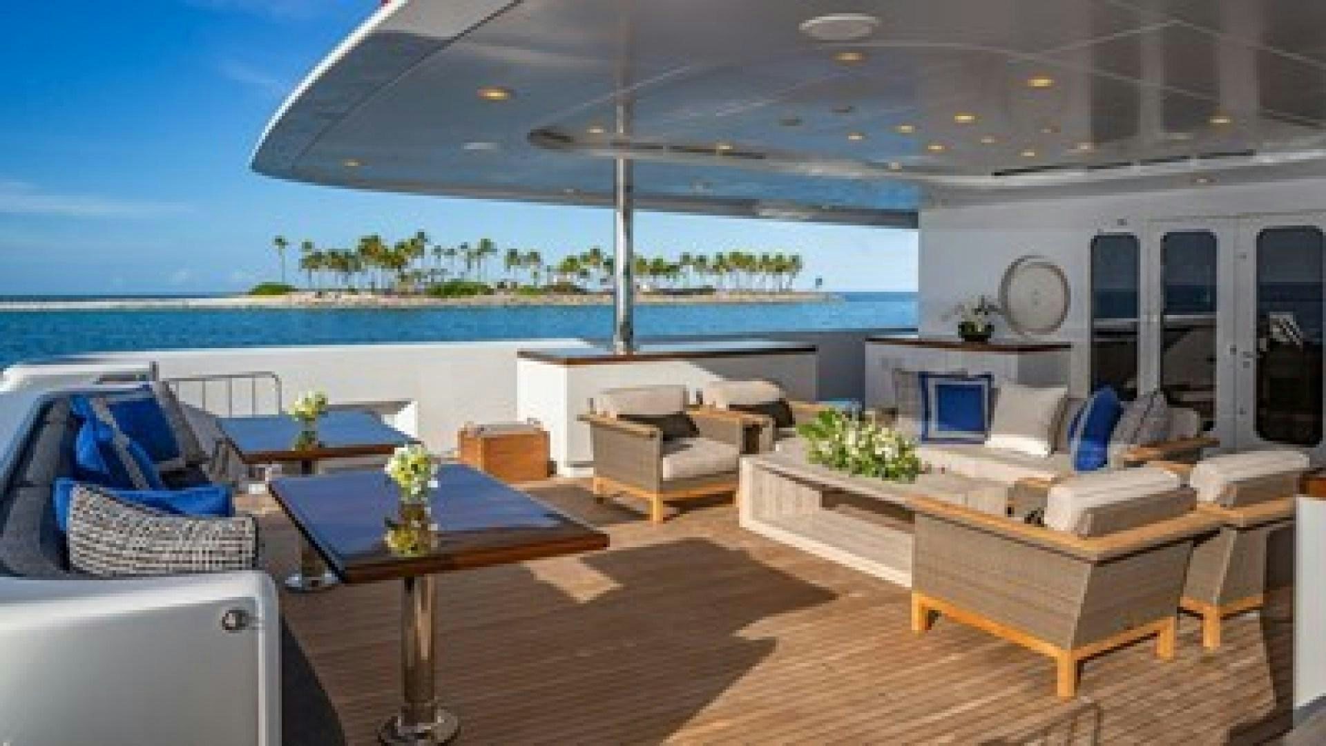 a living room with a large patio aboard HOLDIN' MY OWN Yacht for Sale