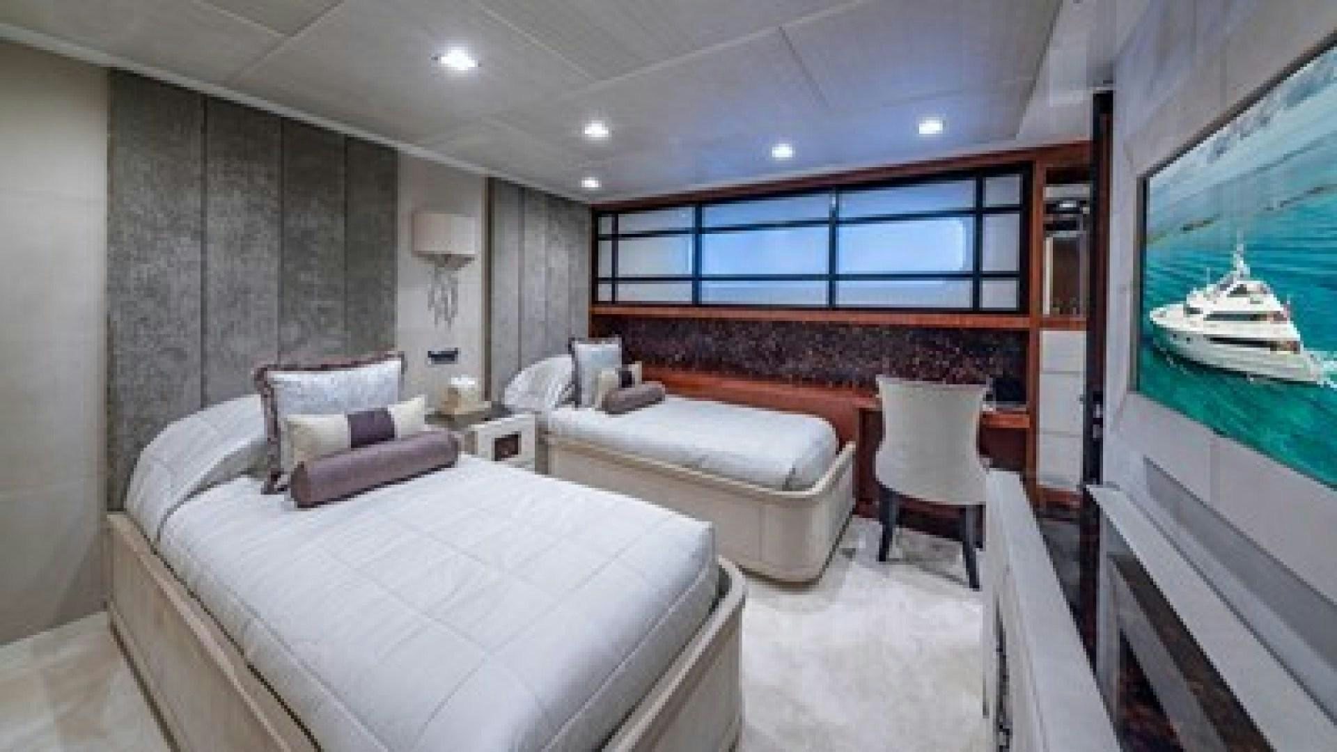 a room with a bed and a chair aboard HOLDIN' MY OWN Yacht for Sale