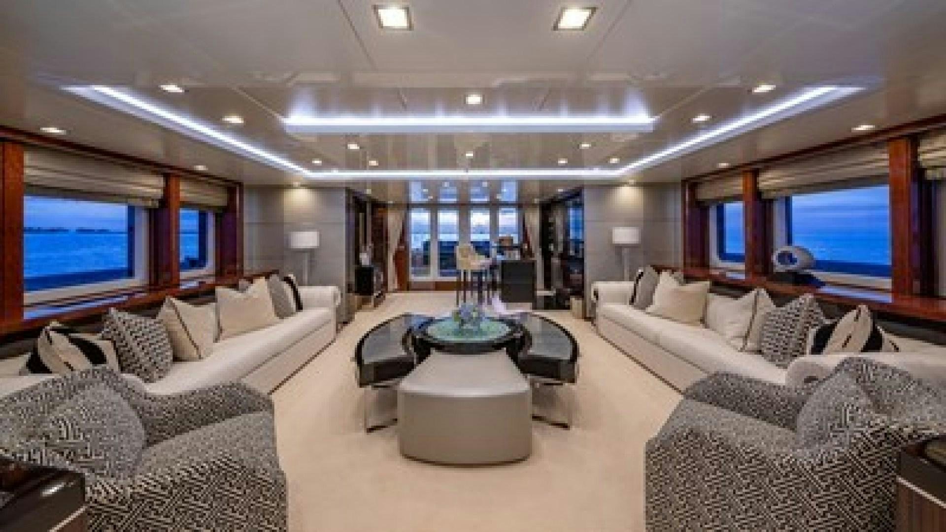a living room with a large screen aboard HOLDIN' MY OWN Yacht for Sale