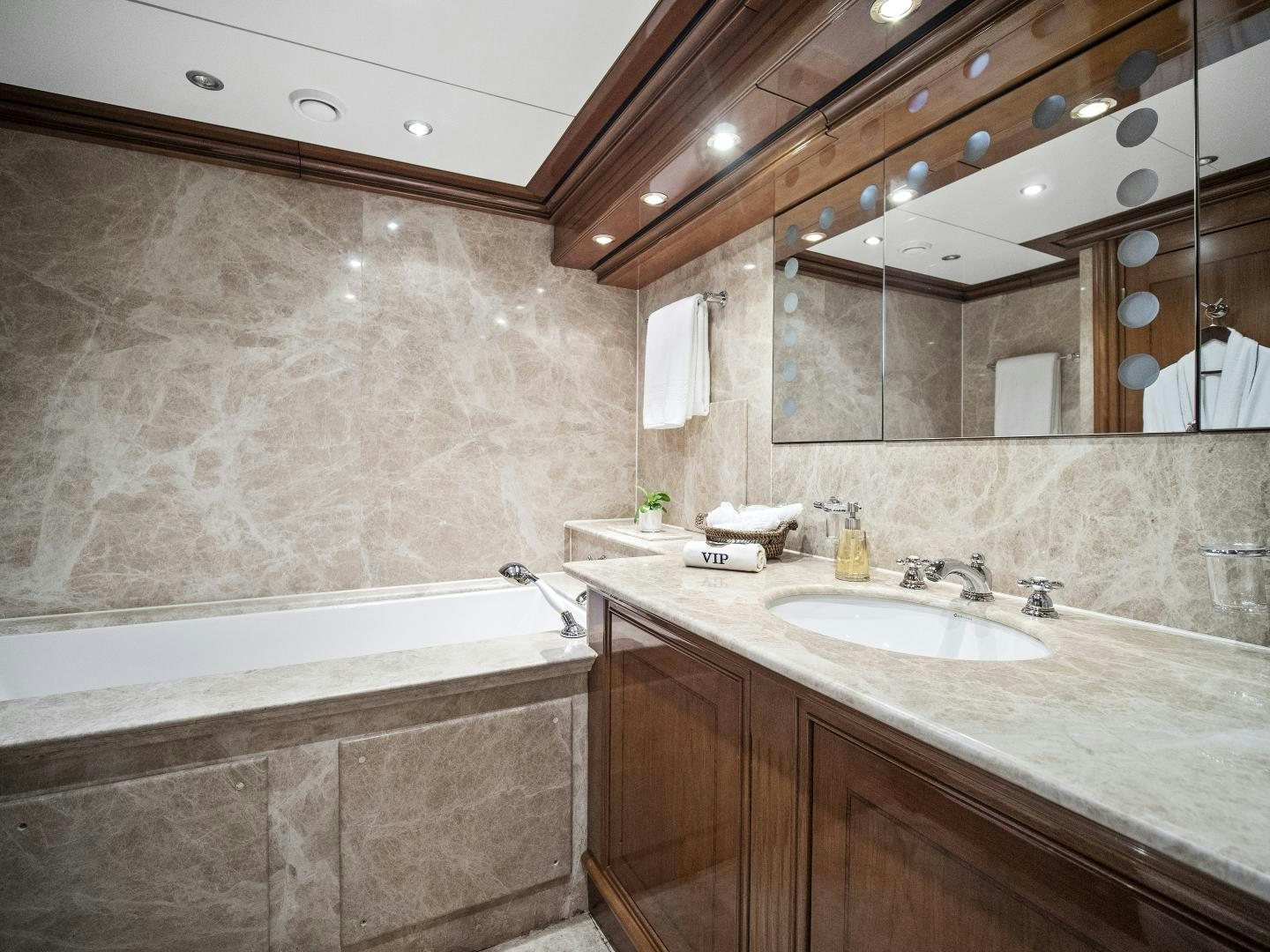 a bathroom with a large mirror aboard THE LANGLEY Yacht for Sale