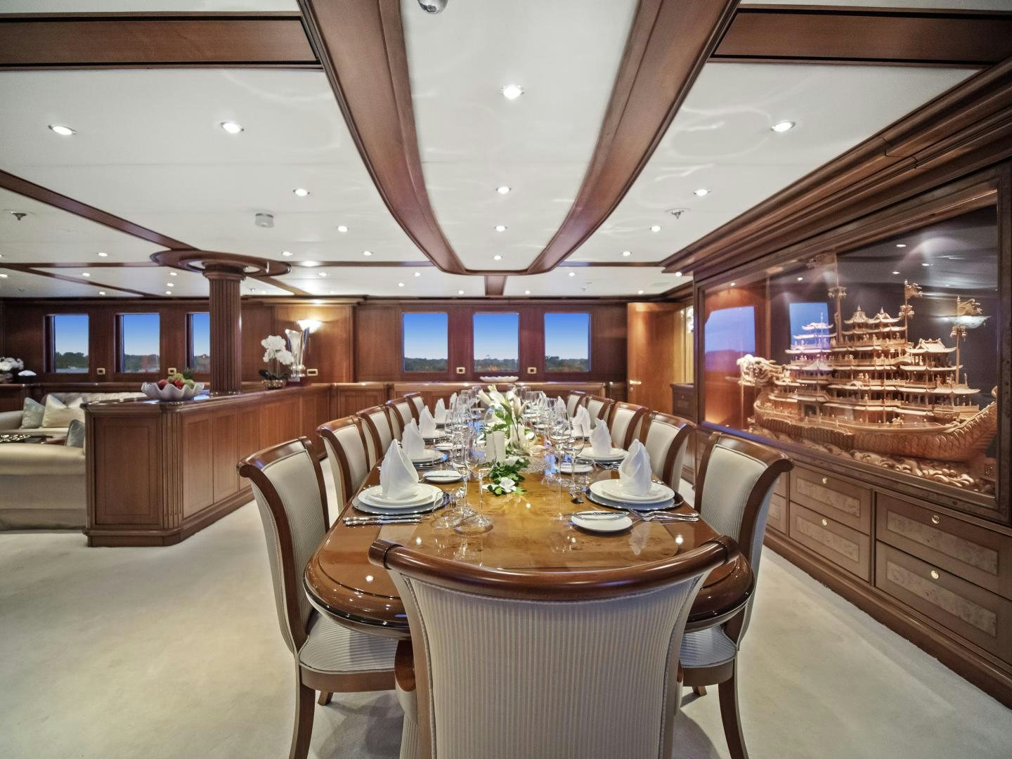 a restaurant with a large table and chairs aboard THE LANGLEY Yacht for Sale