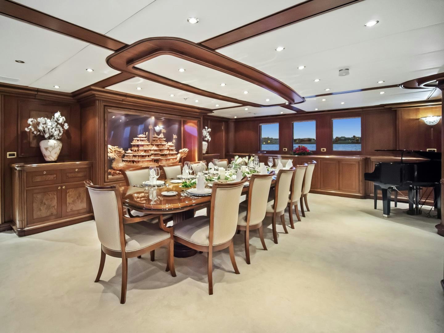 a large dining room with a large table and chairs aboard THE LANGLEY Yacht for Sale