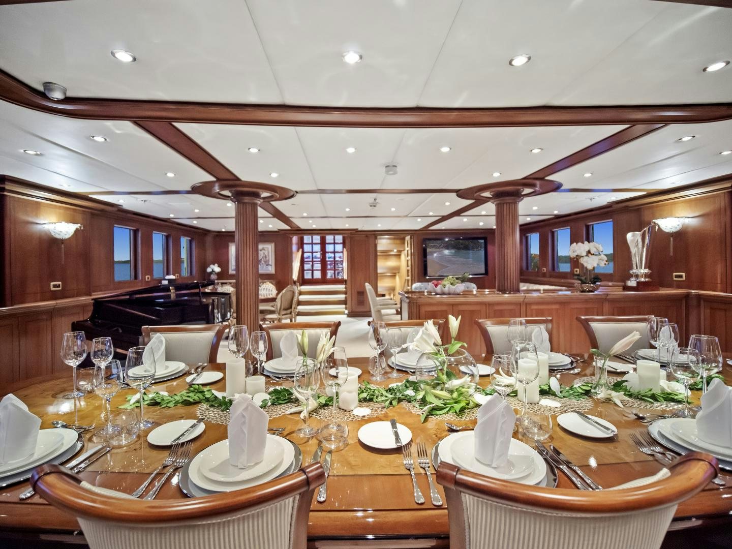 a large dining room with tables and chairs aboard THE LANGLEY Yacht for Sale