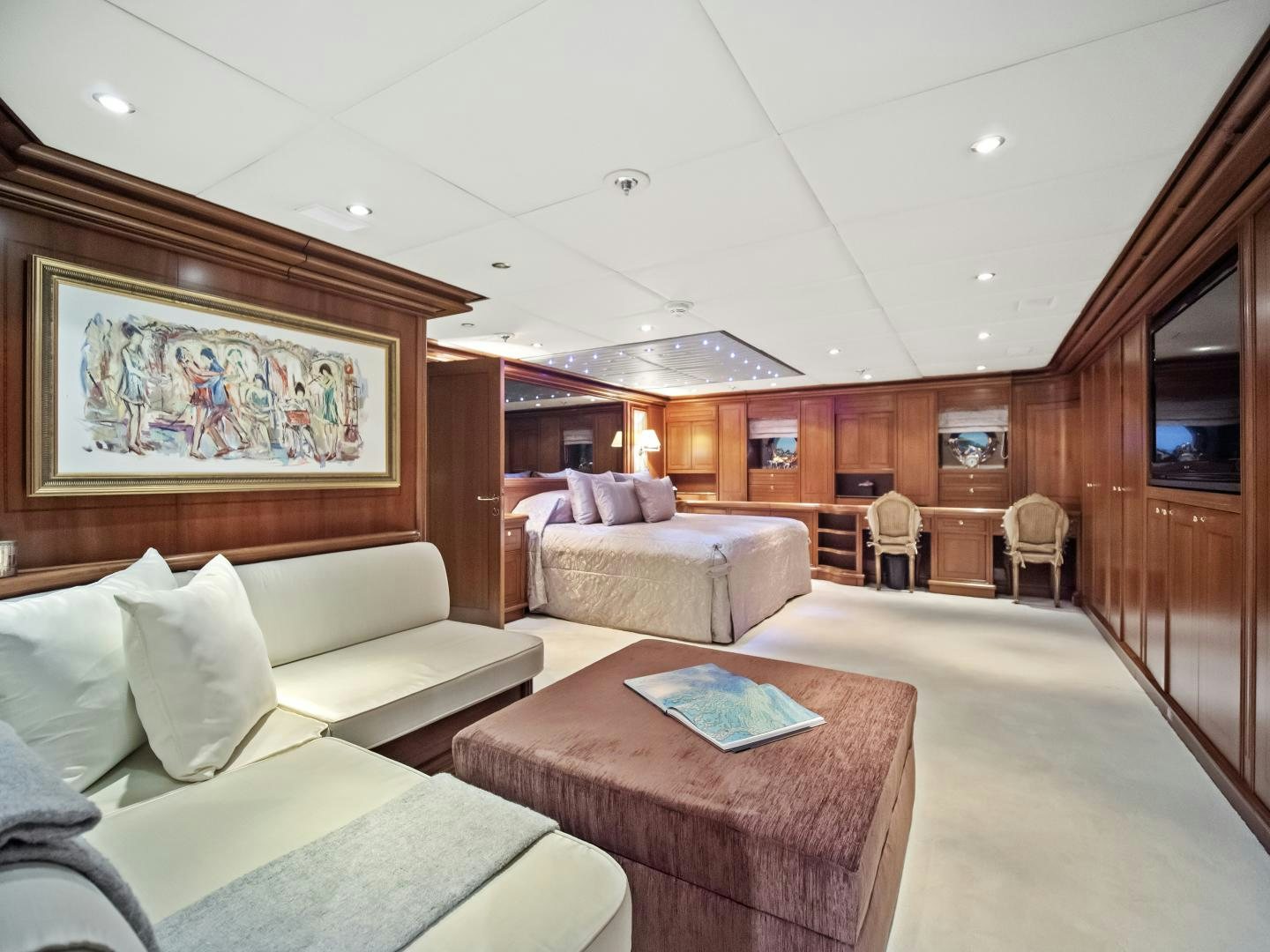 a living room with a couch and a table aboard THE LANGLEY Yacht for Sale