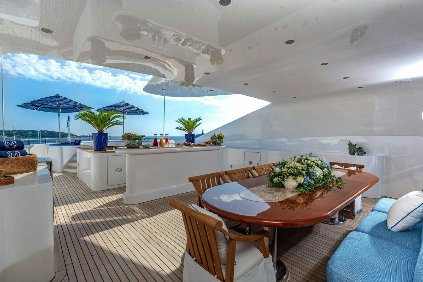 a room with a table and chairs aboard NEXT CHAPTER Yacht for Sale