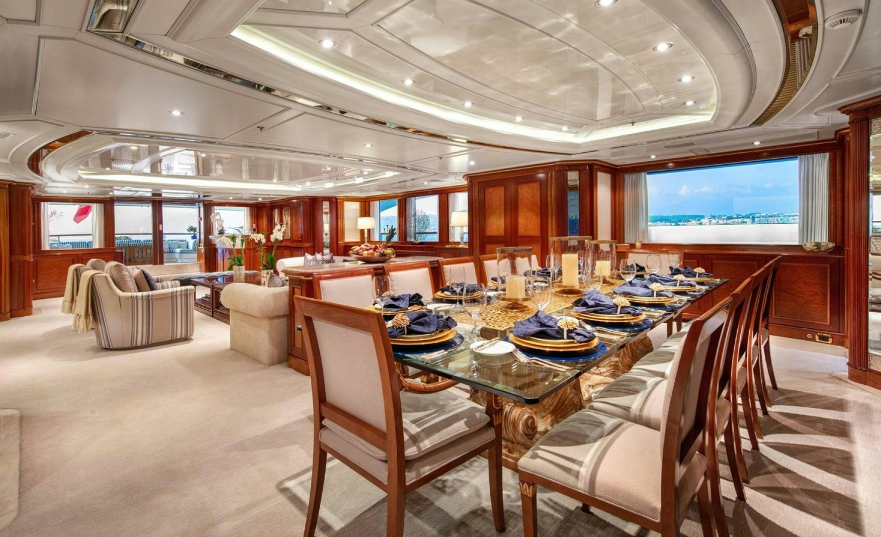 a large dining room with a table and chairs aboard NEXT CHAPTER Yacht for Sale