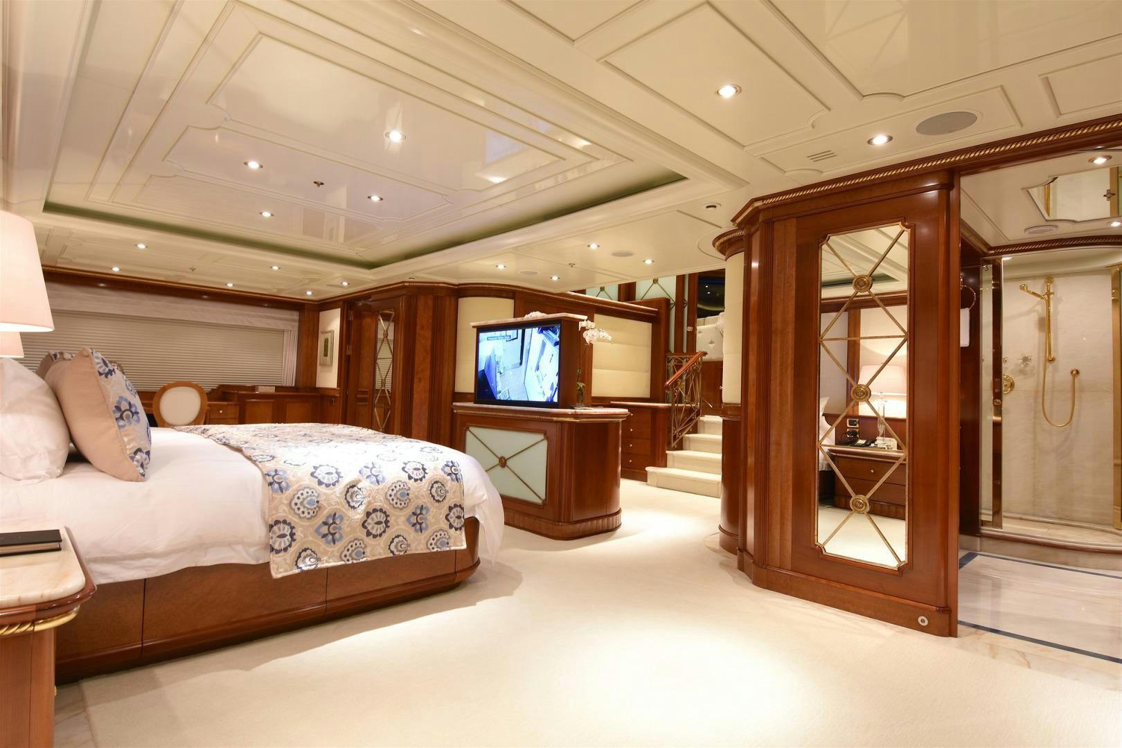 a bedroom with a bed and a tv aboard NEXT CHAPTER Yacht for Sale