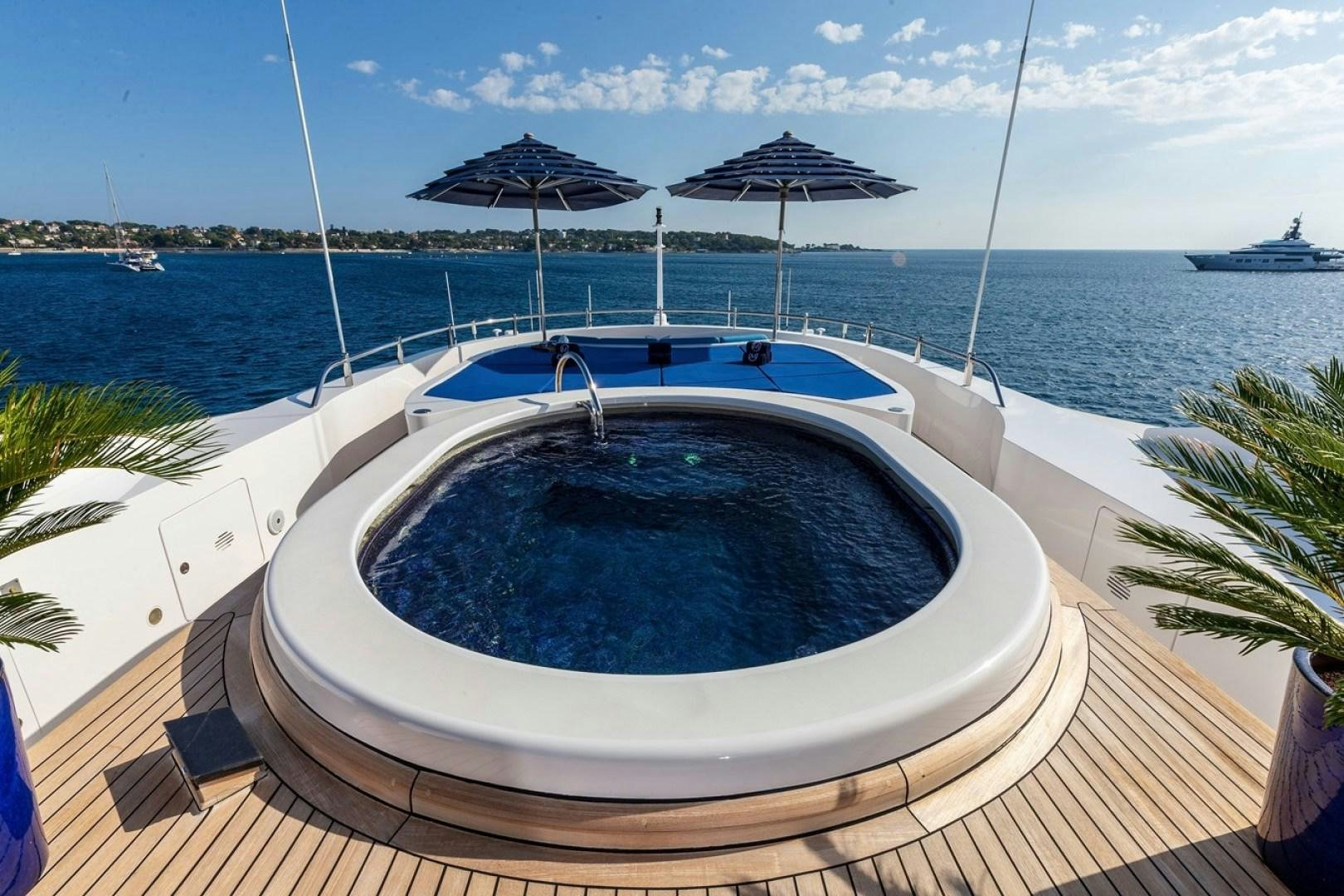 a swimming pool on a deck aboard NEXT CHAPTER Yacht for Sale